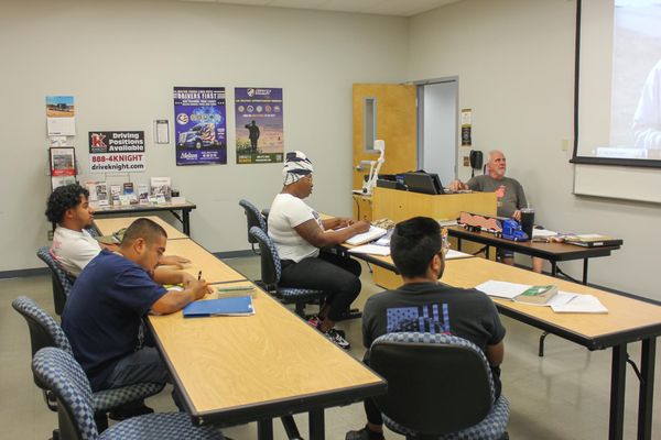 Paid Truck Driving School classroom with students learning