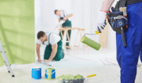 a group of painting worker mixing the paint
