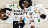 businesspeople-drawing-digital-marketing-diagram-table